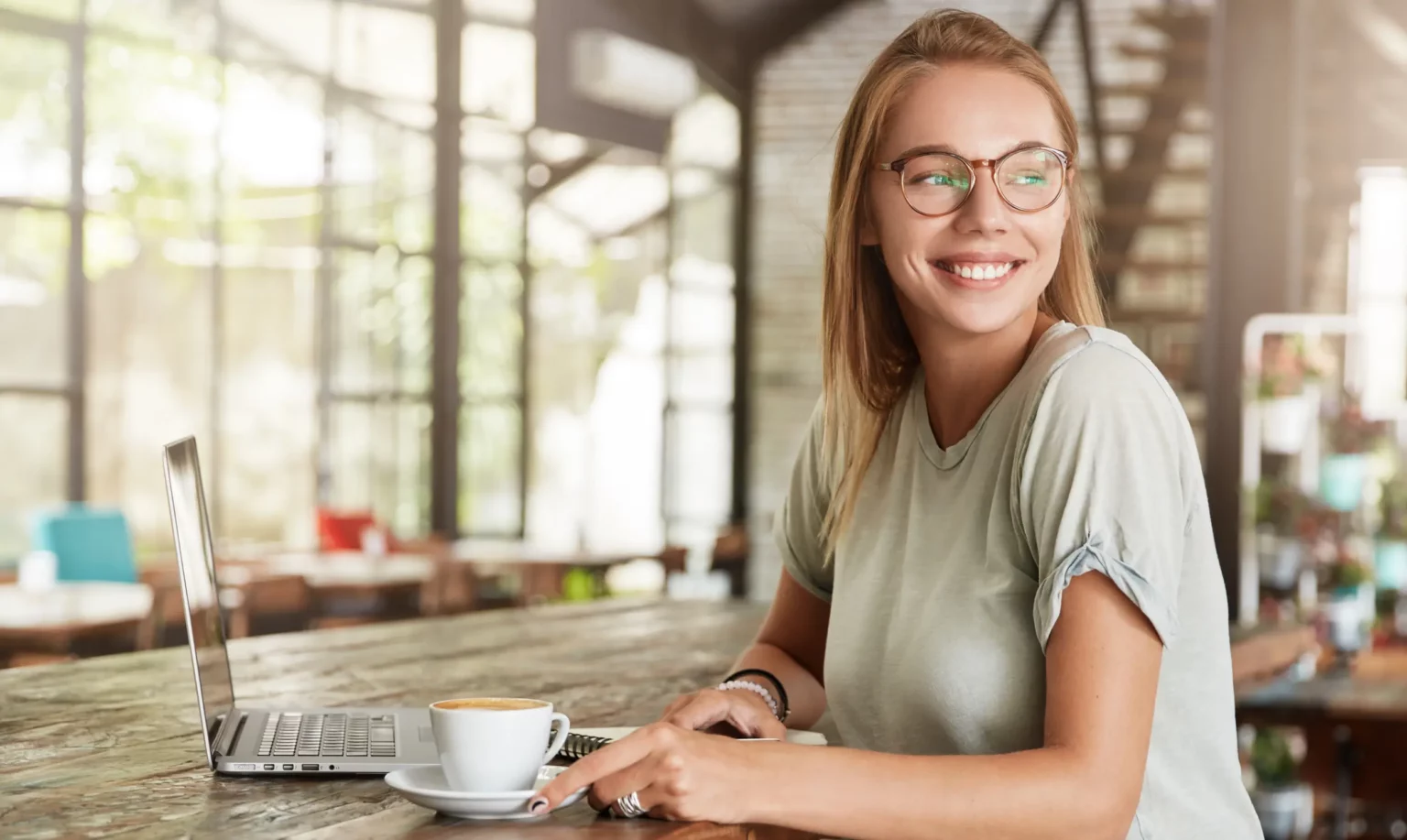 Woman with a coffee and laptop